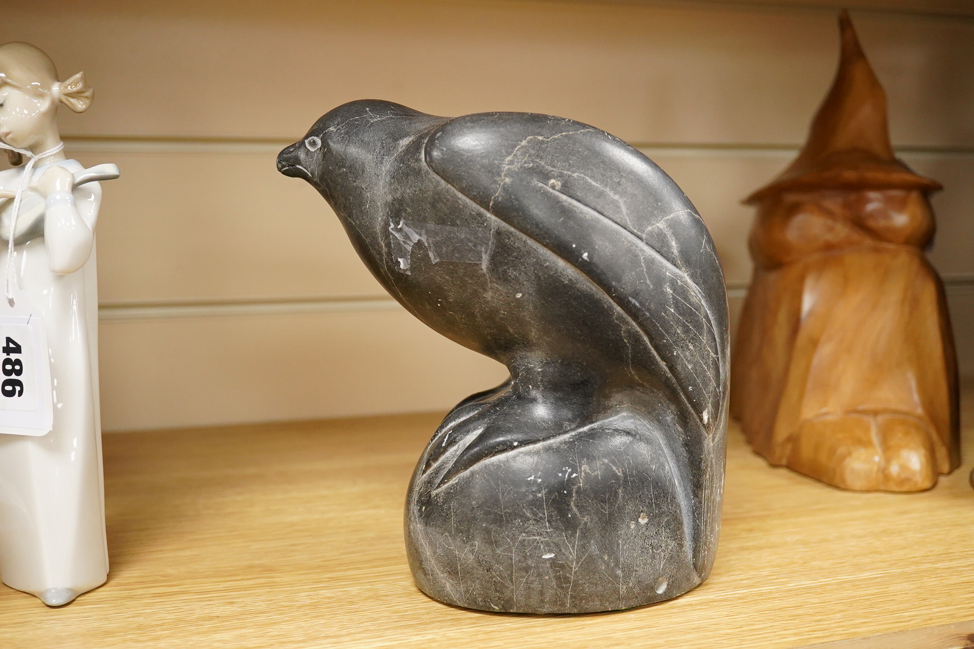 An Inuit stone carving of a falcon by Isapik, 18cm high